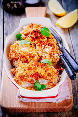 Baked codfish in breadcrumbs in gratin dish