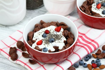 Breakfast chocolate cereal cornflakes with yogurt & chia seeds