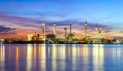 oil refinery industry plant along twilight morning,pink sky