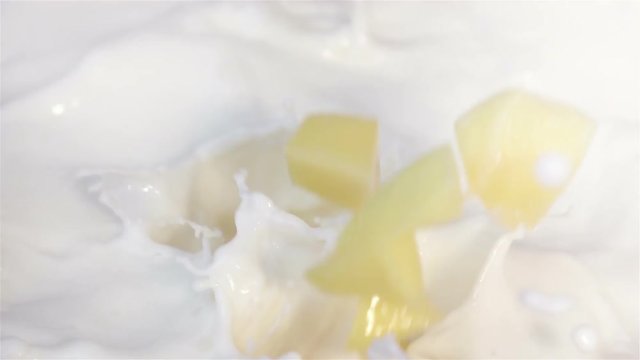 High quality video of mango falling into milk in real 1080p slow motion 250fps