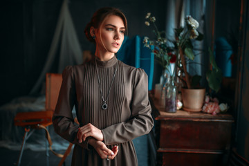 Beautiful female poseur in art studio