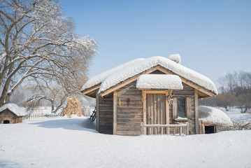 Beautiful wooden house snow covered in China