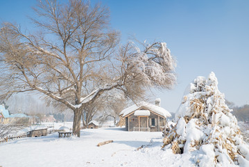 Beautiful wooden house snow covered in China