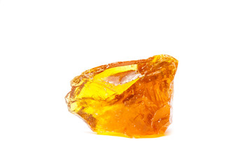 The rubber of the tree is yellow and hardens the resin.