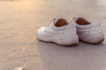 White shoes on the beach with vintage style.