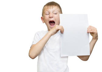 Emotional blond boy in a white shirt with a gray sheet of paper for notes on a white background