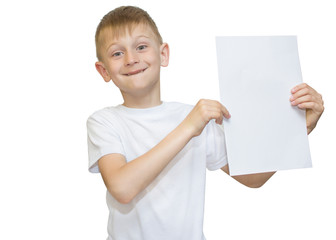 Emotional blond boy in a white shirt with a gray sheet of paper for notes on a white background