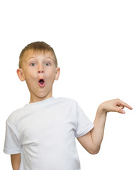 Emotional portrait of caucasian teen boy. Funny teenager pointing and looking upwards while laughing, isolated on white background. Handsome happy child pointing at copy space.
