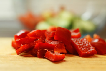 Two red bell peppers on old wooden planks. Rustic take.