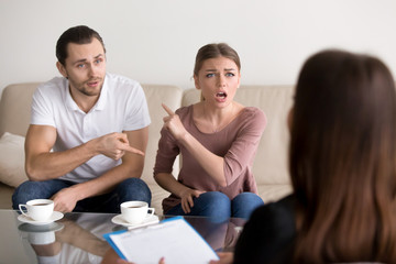 Young fighting angry couple blaming each other for problems, telling its your fault, discussing...