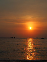 Naklejka na ściany i meble Sunset on beach in Phu Quock Island. Vietnam, March 2017.