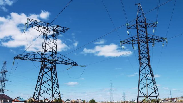 High-voltage wires on electrical supports. Electric power supply. Transportation of electricity by wire. Energy industry. profitable business. Generators and transformers