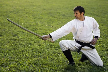 Crédence de cuisine en verre imprimé Arts martiaux martial arts with wooden sword