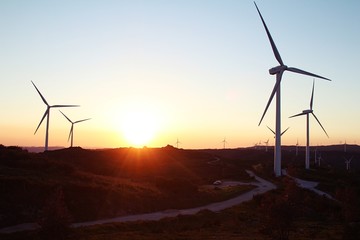 Wind generator and sunrise. Portugal