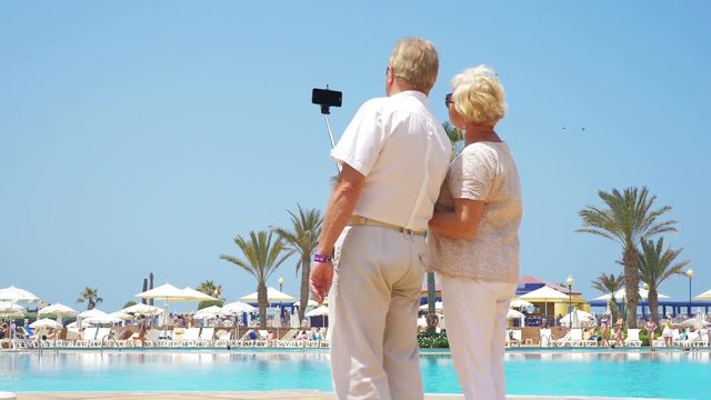 High quality video of senior couple taking a selfie picture on the tropical vacation in 4K  Video series of senior couple on tropical vacation More videos from this series in my portfolio