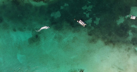 Top View of a yacht on green reef ocean, Bahamas	