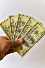 Holding one hundred dollar bills, isolated white background