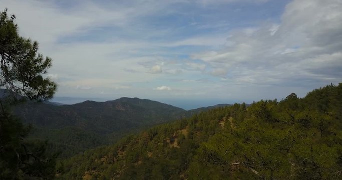Flight over the cedar valley. landscape of mountains in the mist Cyprus.Drone Point of View Platres in the Troodos. Cyprus. Aerial View. Flying over the mountains