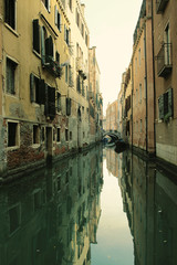 Fototapeta na wymiar Impression of Venice with its beautiful canals, boats and old houses, Italy