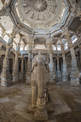 Interior of the majestic jainist temple at Ranakpur, Rajasthan, India. Architectural details of stone carvings.