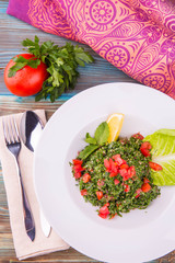 The cut in small pieces parsley with fresh tomatoes and onions: in lemon juice sauce, with mint and olive oil