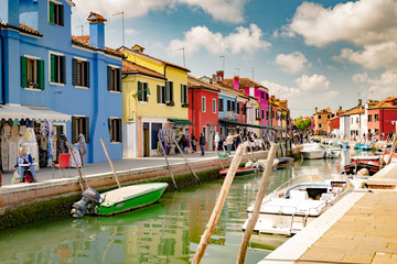 Fototapeta na wymiar Colorful houses by canal in Burano, Venice, Italy.