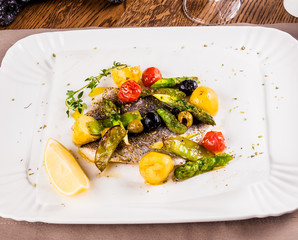 Fillet of Dorado fish baked with vegetables
