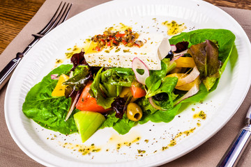 Greek salad on white plate
