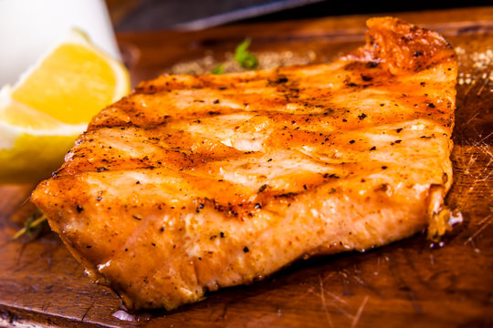 Grilled Salmon Fish On Wooden Board