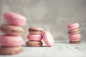 Stack of Raspberry and Chocolate pastel colored Macarons or Macaroons