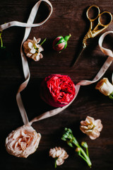 flowers and ribbons on the dark table