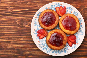 Cottage cheese patties with strawberry jam.