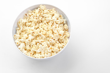 Popcorn in the bowl on white background - Soft focus
