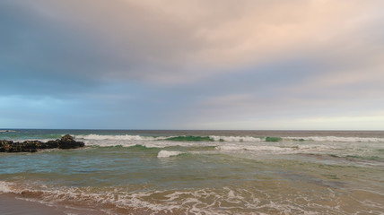 Waves Rolling in the Ocean with Cloudy Skies in South Africa