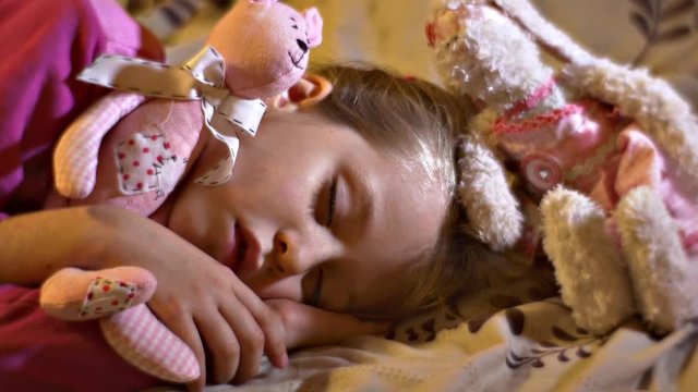 Little Girl Sweetly Sleep Hugging Her Favorite Toys, the Sweetest Dreams After the Game
