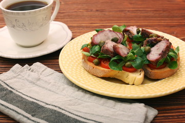 Open sandwich with pork greens and capers