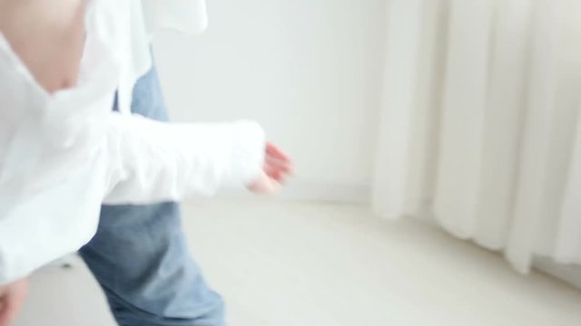 father turns son on his head and fooling around at home