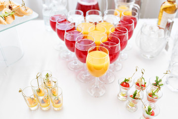 Restaurant Cocktail Tables in the Cocktail party. ice in a transparent glass bowl and metal sticking. festive buffet, alcoholic and alcohol free drinks.