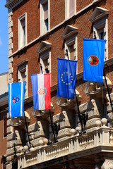 Flag of the county, the state, the European Union and the city on the facade of town hall of Rijeka, Primorje-Gorski Kotar County, Croatia, Europe