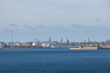 Copenhagen cityscape. Seen from the Oresund strait, in a southwest direction. Copenhagen is the capital of Denmark. Wide angle view.