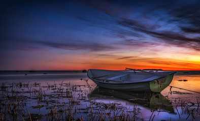 Sunset and boat in beach