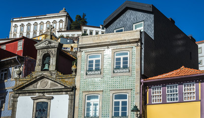 Fototapeta na wymiar Twonhouses and small Lada Chapel and houses in Ribeira district, Porto, Portugal