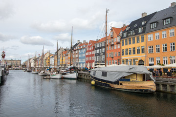 Fototapeta na wymiar Nyhavn district in Copenhagen, the capital of Denmark. Nyhavn is a 17th-century waterfront, canal and entertainment district.