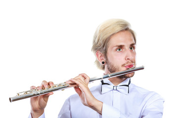 Male flutist playing his flute