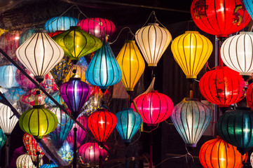 Fototapeta na wymiar Colorful lanterns spread light on the old street of Hoi An Ancient Town, Quang Nam Province, Vietnam. UNESCO World Heritage Site