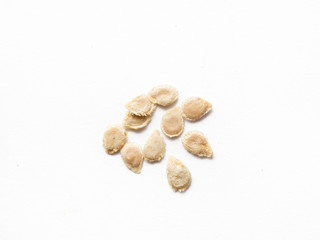 Tomato seed on white isolated background