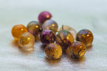 Ball shaped crystals made of epoxy resin and glitters