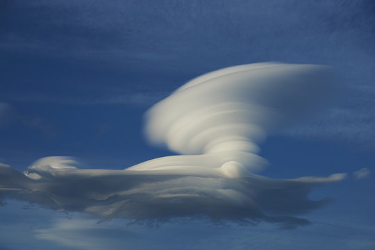 Lenticular clouds in the skies above Torres del Paine National Park in Patagonia, Chile