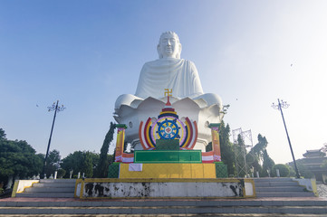 Big white meditating Amitabha Buddha statue located in Quang Minh Mahayana Buddhism temple in Da Nang, Vietnam 