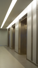 In front of elevator. Inside office building